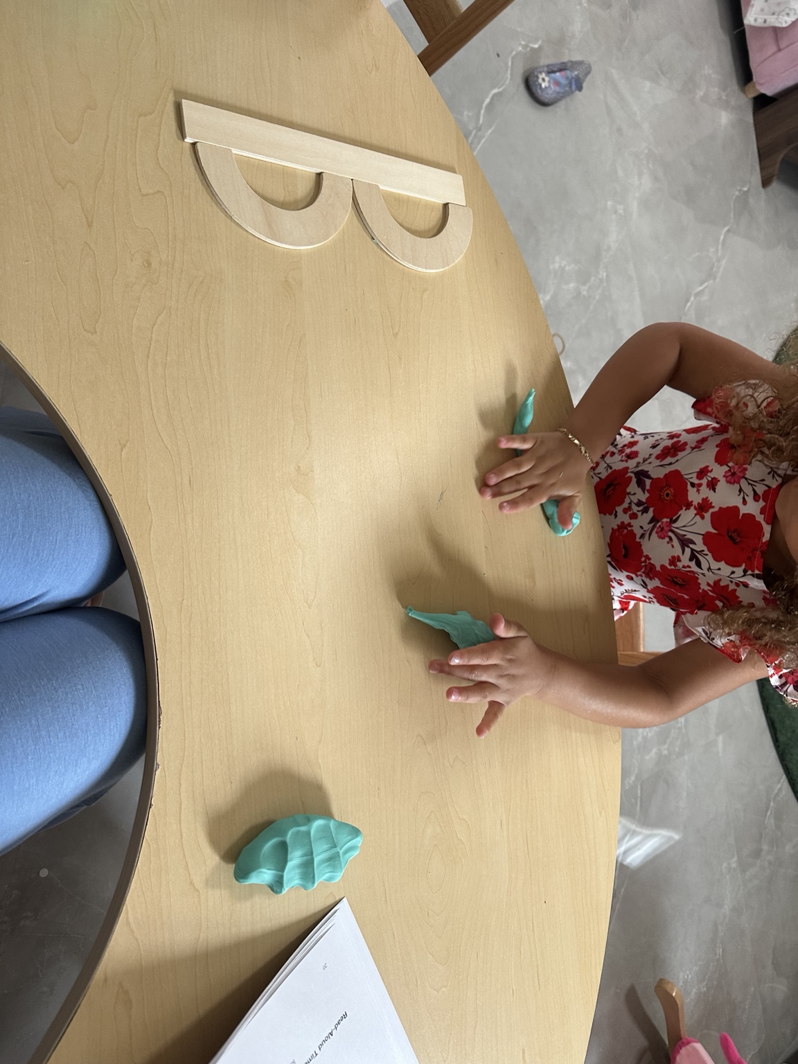Wooden letter-building pieces used during letter B lesson